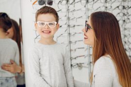 child trying on glasses